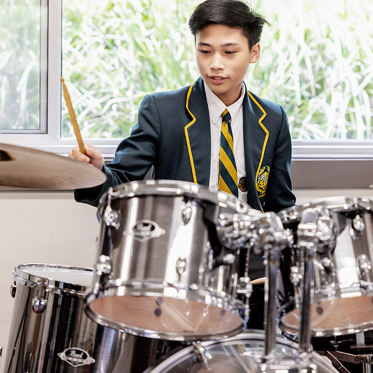 Student on drums at St Patrick's Marist College Dundas