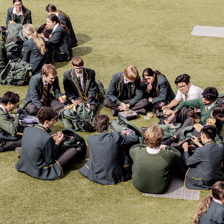 St Patrick's Marist College Dundas students sitting on lawn